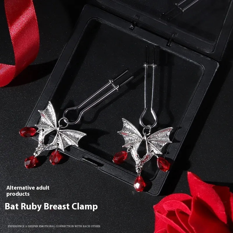 Silver alloy Diamond Bat Nipple Clamp with adjustable screw and ruby bat clip on a white background