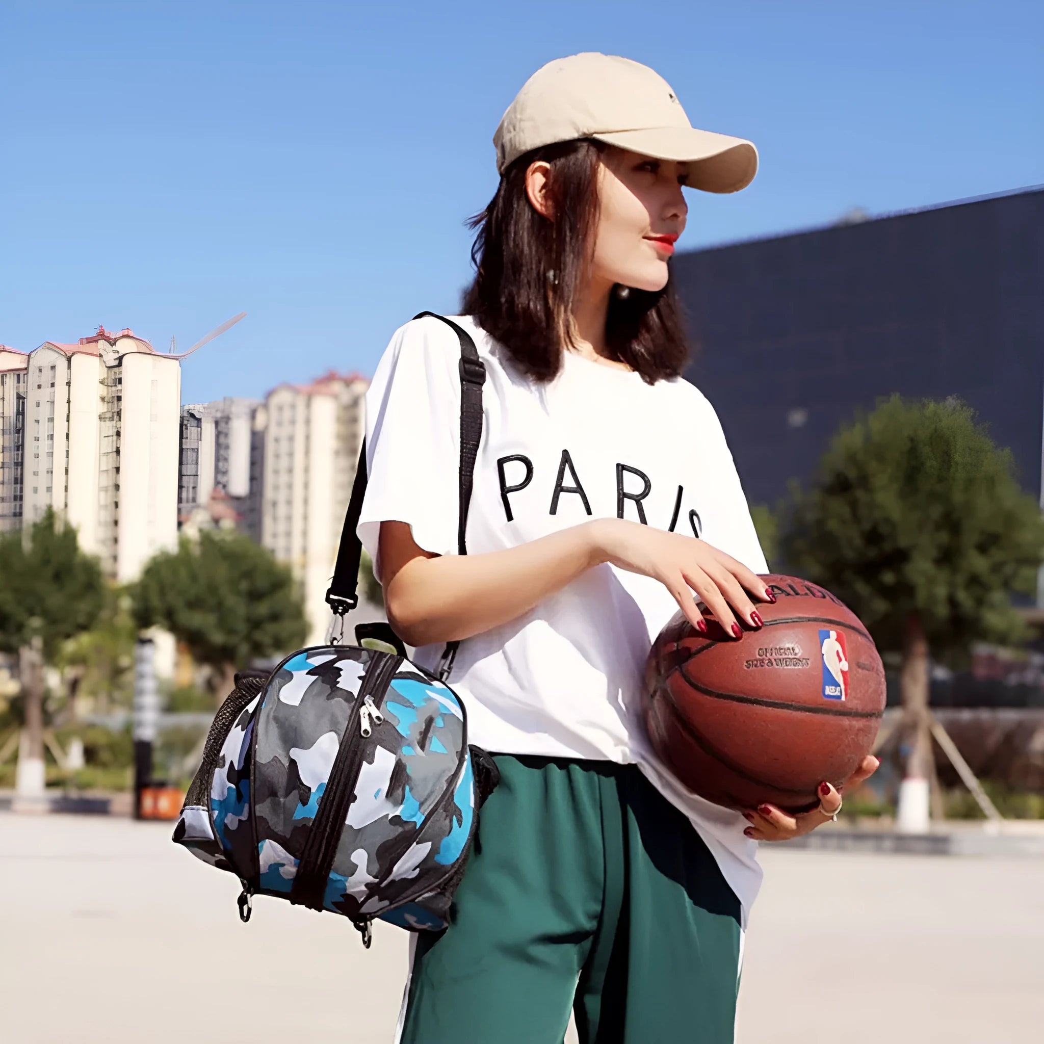 Black oxford cloth basketball training bag with 9L capacity showing one-shoulder carrying strap