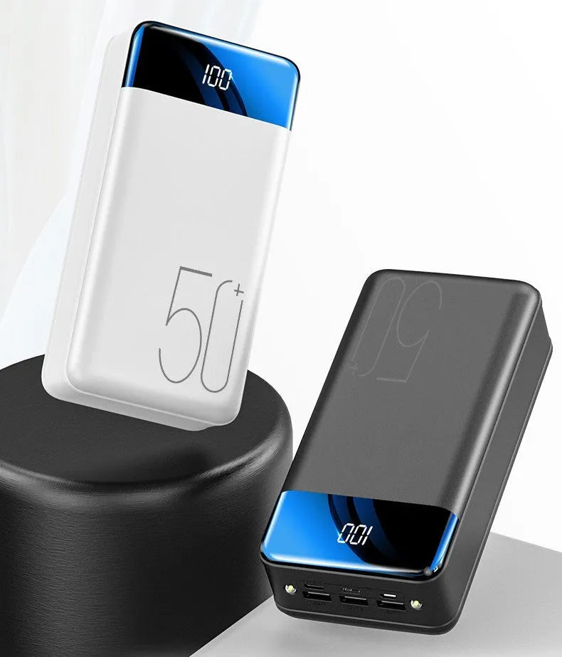 Large black power bank showing three output ports and display screen measuring 169mm