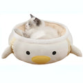 Green dinosaur and chick shaped cat bed shown both as a flat sofa and hanging as a hammock.