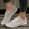 Women's creamy-white fabric casual sneakers with low-top design and rubber sole