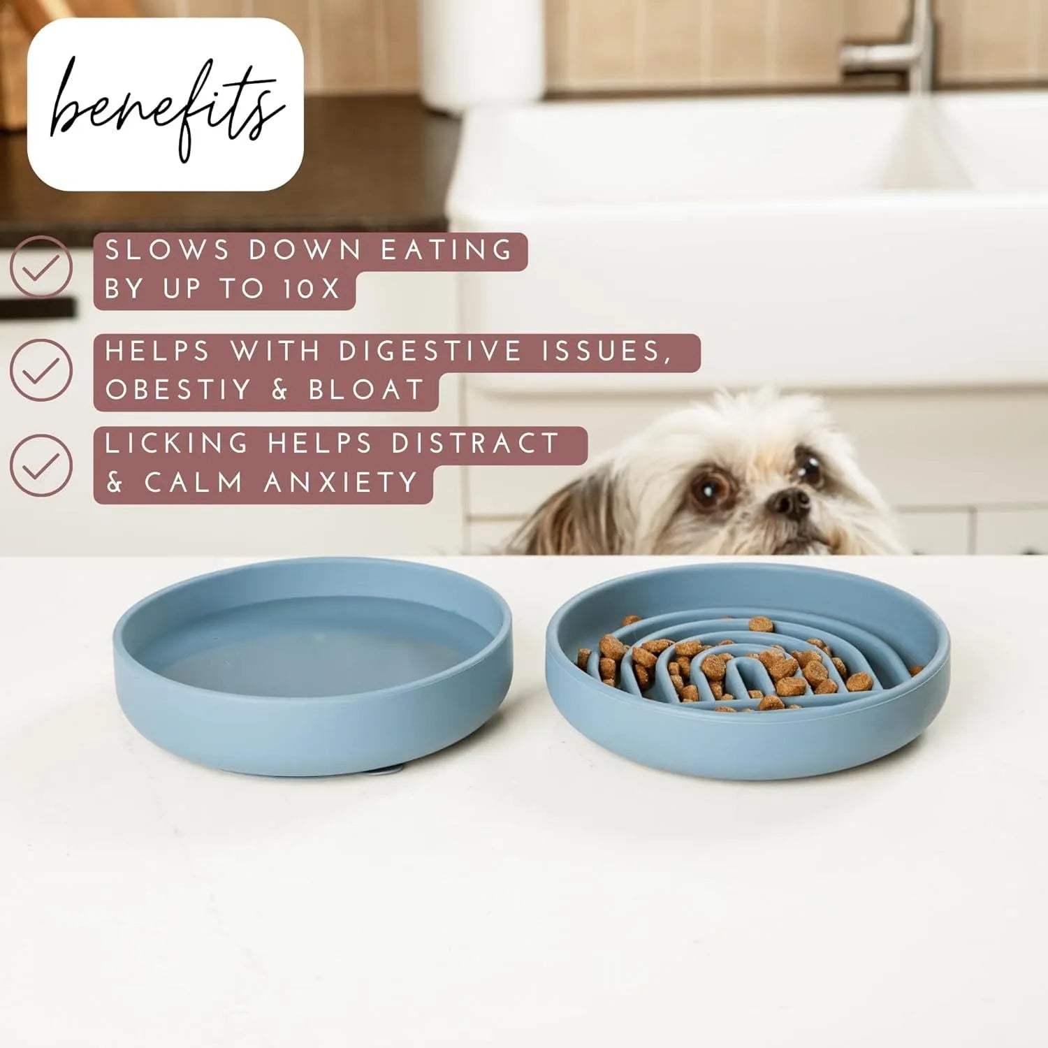 Silicone dog slow feeder bowl with ridge design in various colours on a kitchen counter.