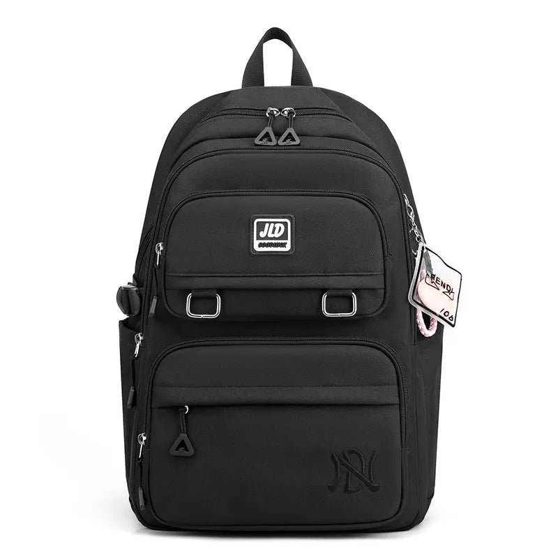 Girls' large nylon school backpack in a choice of colours and patterns including geometric graffiti and solid purple.