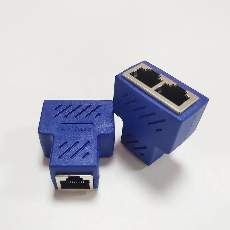 Two white RJ45 network cable splitter adapters showing one input and two output ports.