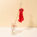 Octopus-themed cat toy with long stick attachment in bright colours for indoor feline play
