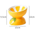 Ceramic raised cat bowl in orange colour with tilted design and patterned detail on a non-slip base