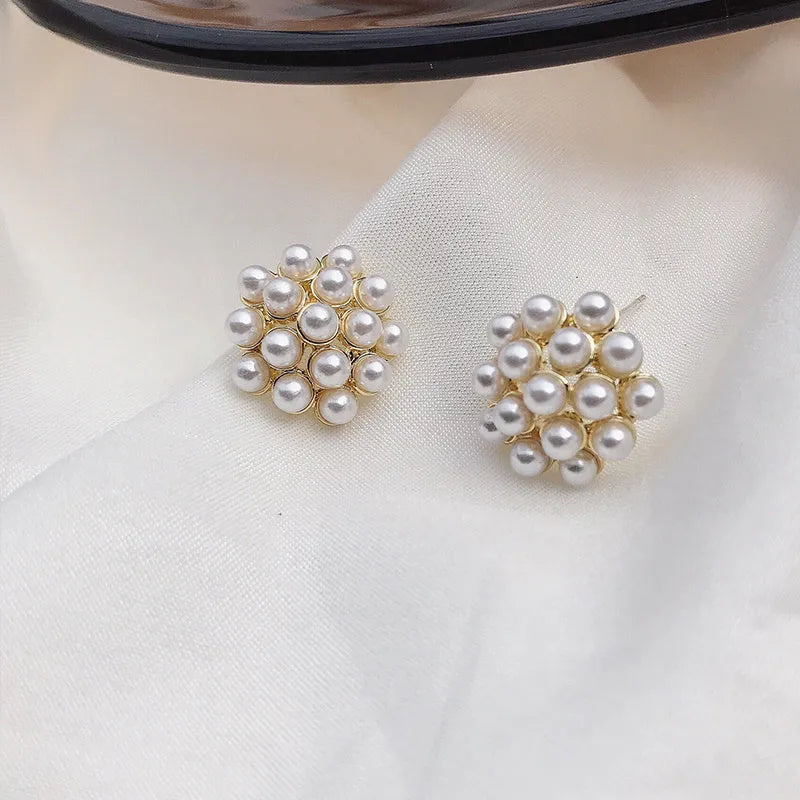 Korean style women's pineapple starfish pearl drop earrings with alloy electroplated finish and gem stone inlay.