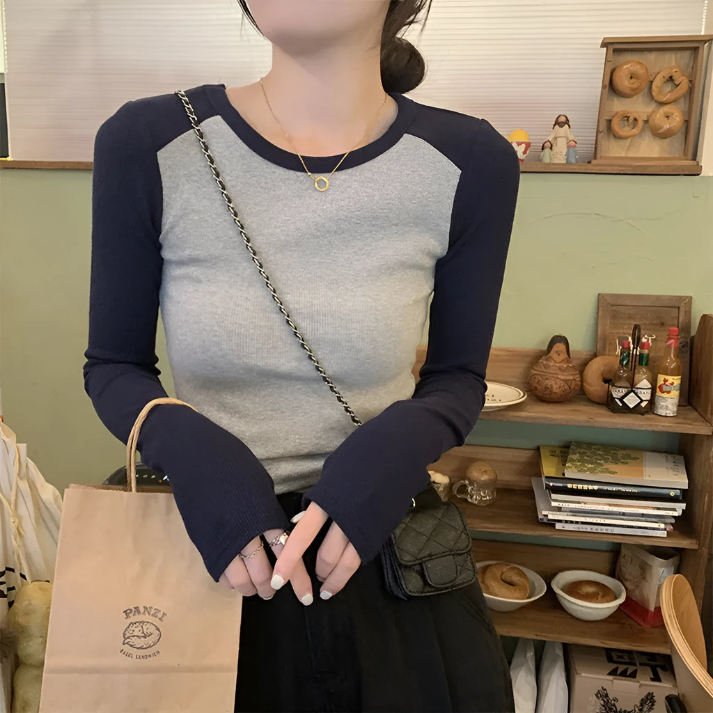 Women's dark blue viscose slim-fit top with princess sleeves and embroidery, shown in an oversized short-length design.