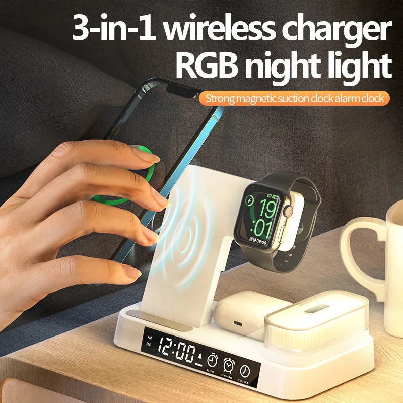 4-in-1 wireless charger station with alarm clock display and foldable stand charging a phone, headphones and watch