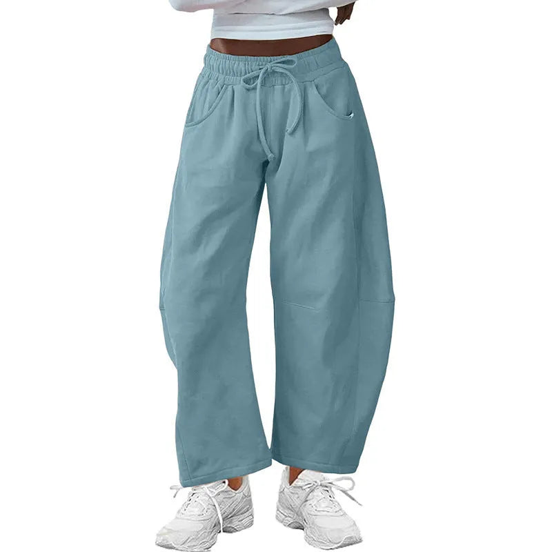 Loose-fit cropped sweatpants with drawstring waistband and side pockets in multiple colour options