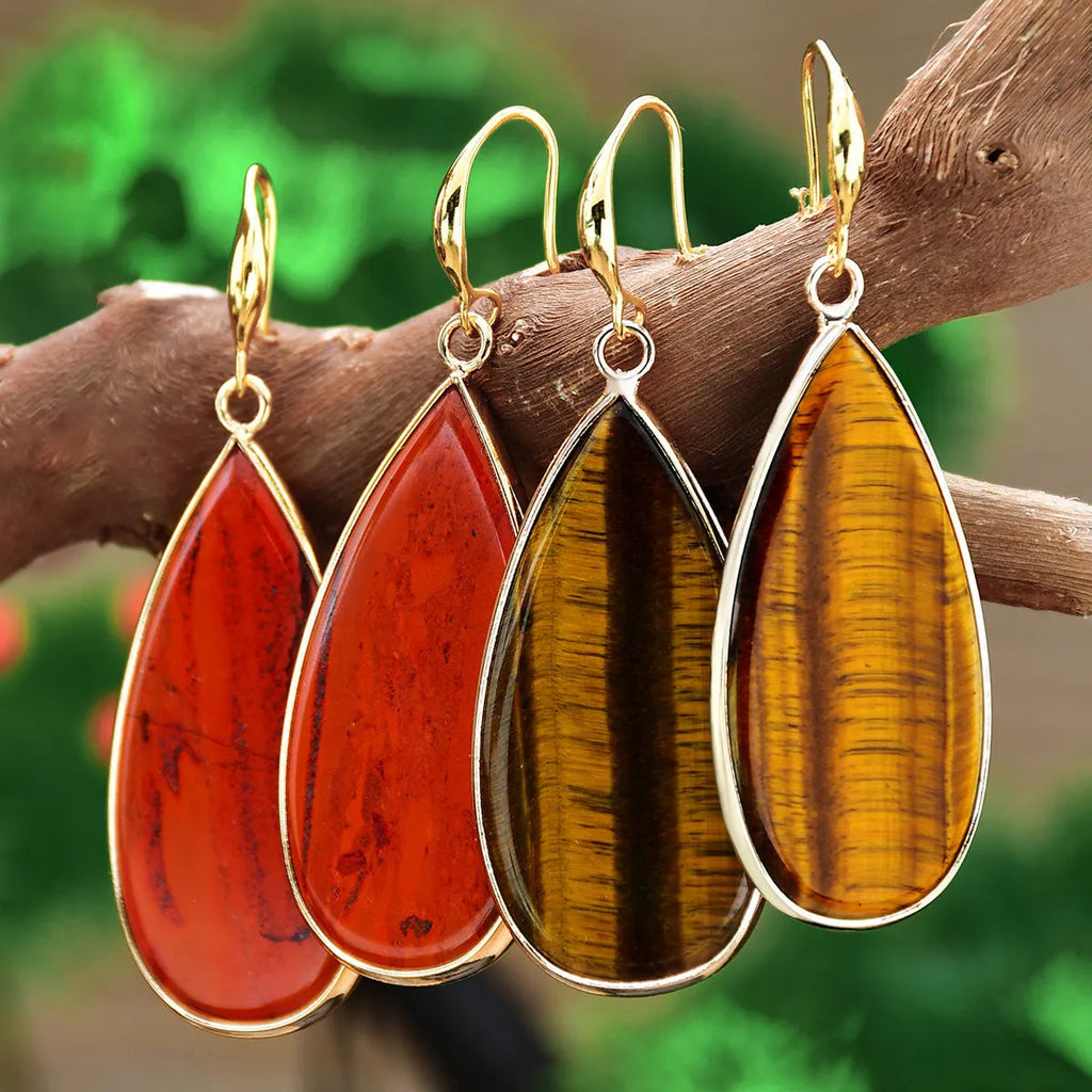 Vintage long water drop earrings in natural stone with textured surface and retro style