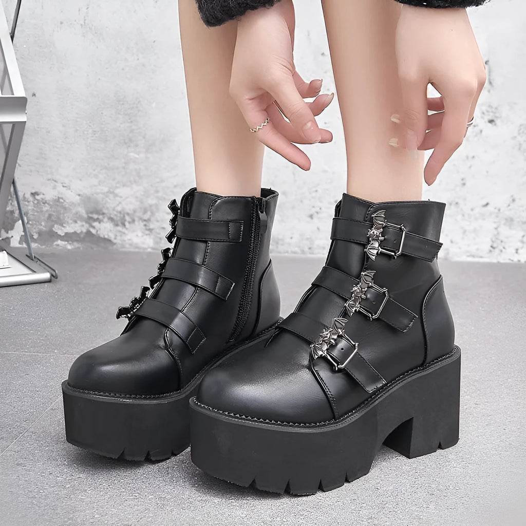 Black women's punk ankle boots with bat buckle and side zip closure