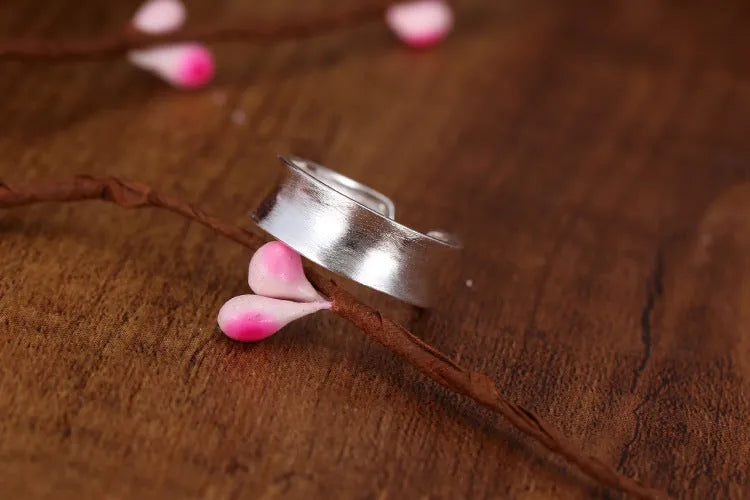 Geometric open ring with frosted silver finish and adjustable opening design