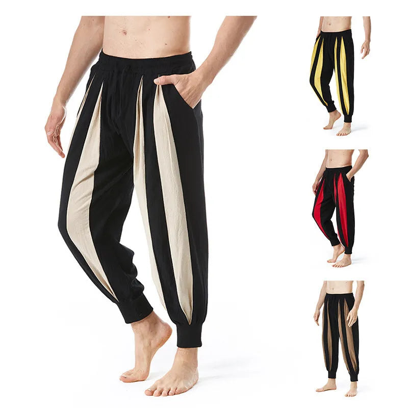 Man wearing straight-leg casual trousers in one of four available colours: brown, khaki, red, or yellow.