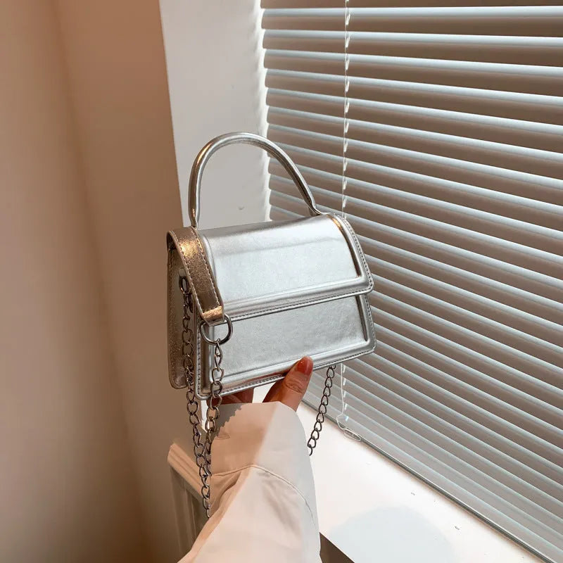 Retro PU leather crossbody shoulder bag in horizontal square shape on display