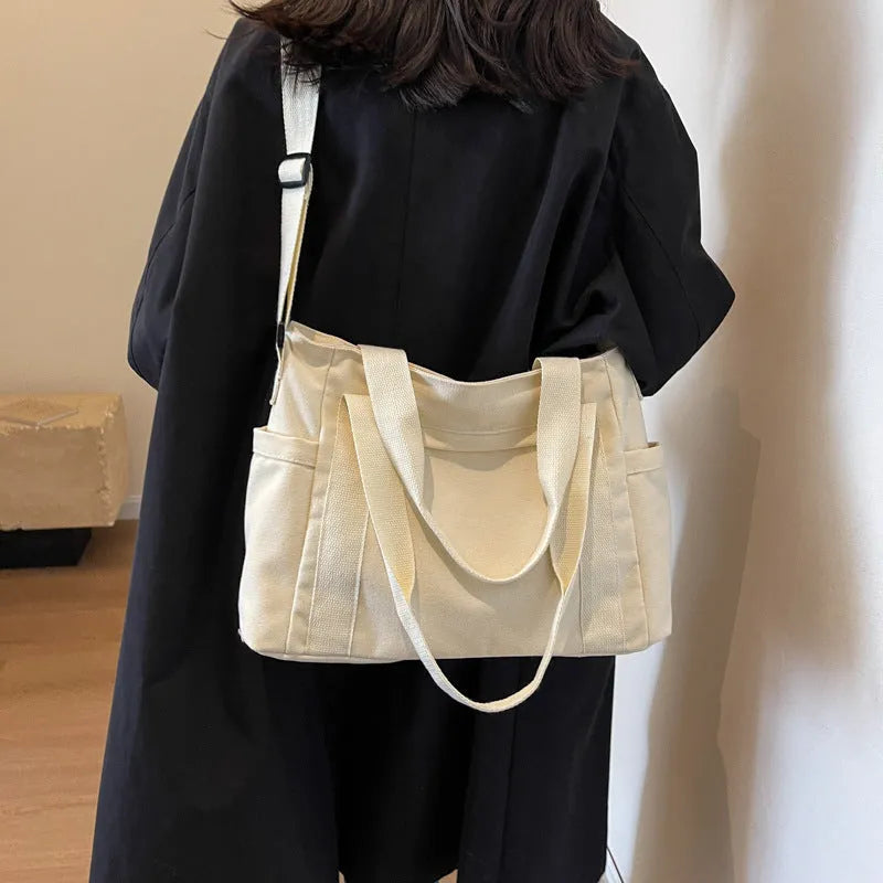 Women's polyester canvas shoulder tote bag in solid colour with exterior sandwich pocket