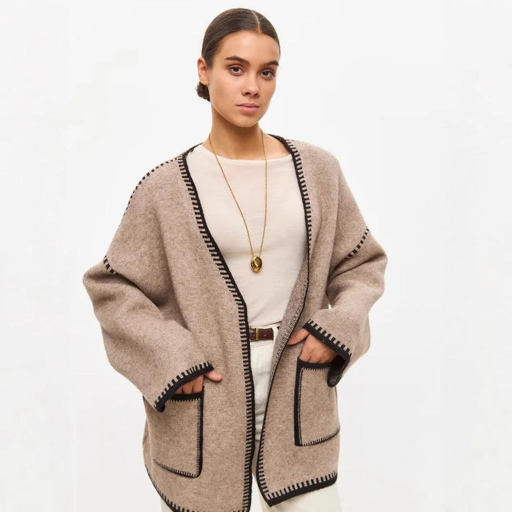 Lace-up front knitted cardigan in a loose fit, shown in black, camel, and white colour options.