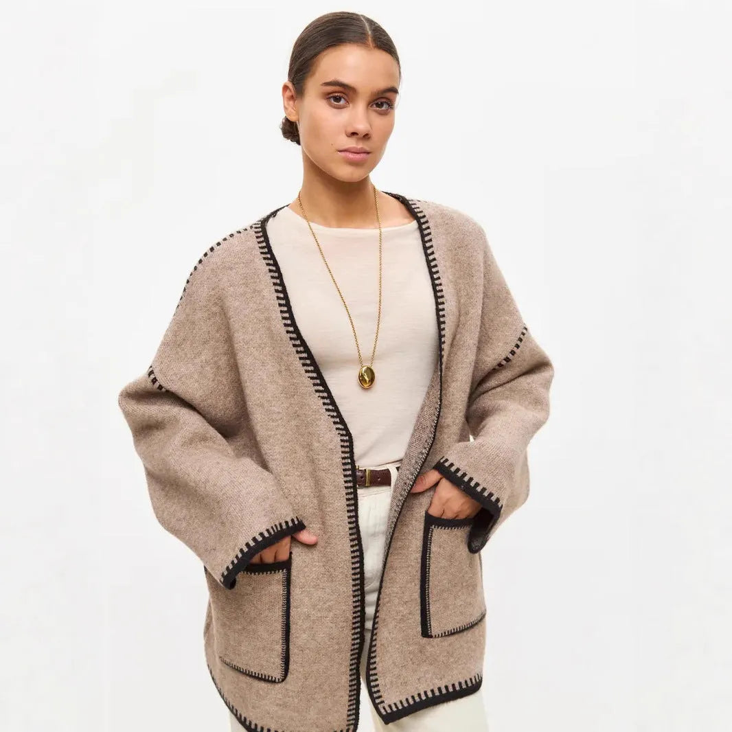 Lace-up front knitted cardigan in a loose fit, shown in black, camel, and white colour options.