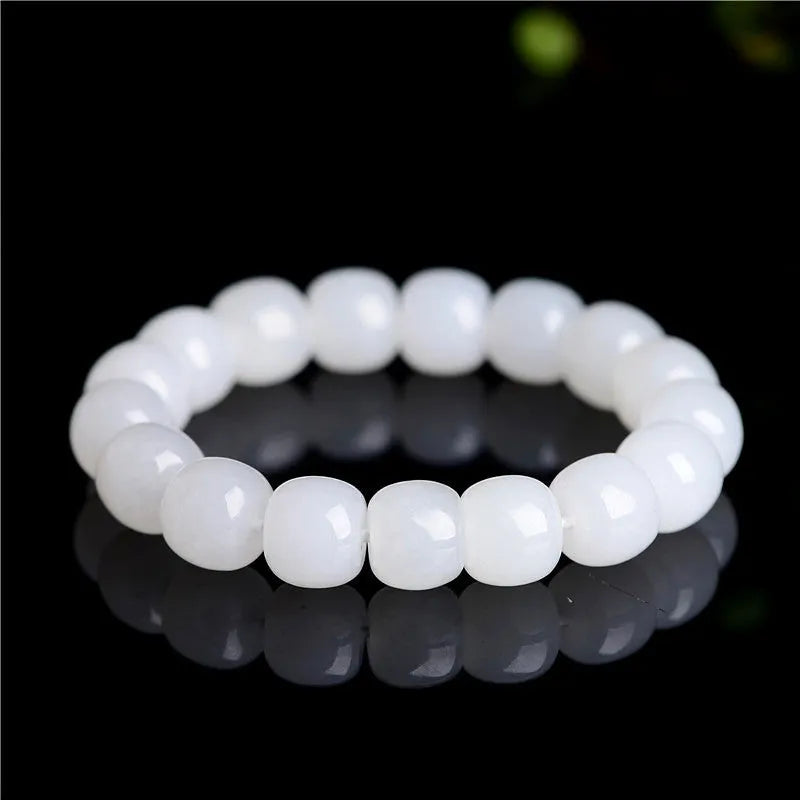 White Hetian jade barrel bead bracelet shown on a wrist, showcasing its unisex casual style.