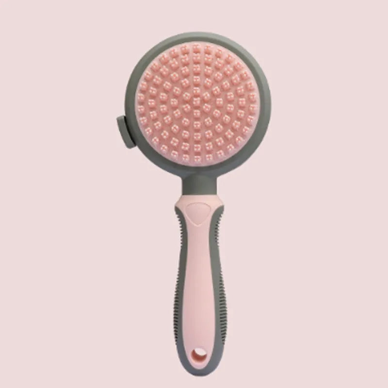 Green and pink two-sided silicone pet grooming brush with slicker brush and massage head.