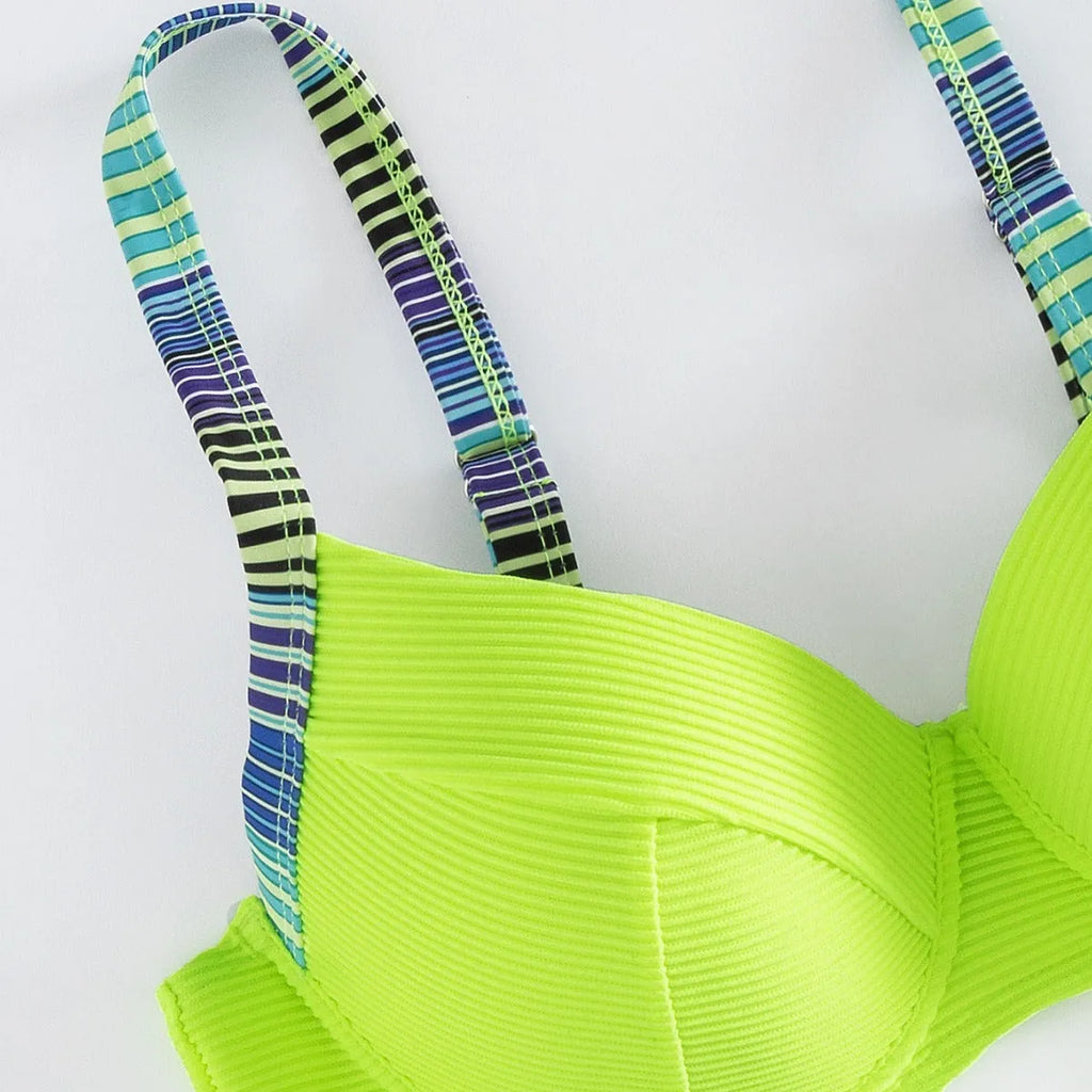 Women's green printed polyester halter bikini set with high-waist briefs on white background