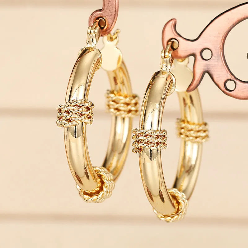 Geometric copper ear clips with linear and ring design in golden colour