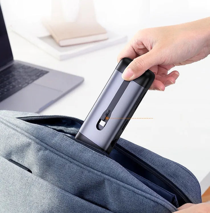 USB-C docking station showing HDMI, USB 3.0, VGA, and ethernet ports on a 9-in-1 model with short connecting cable.