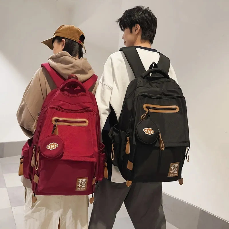 New large-capacity nylon school backpack for middle school students in solid colour with curved shoulder strap