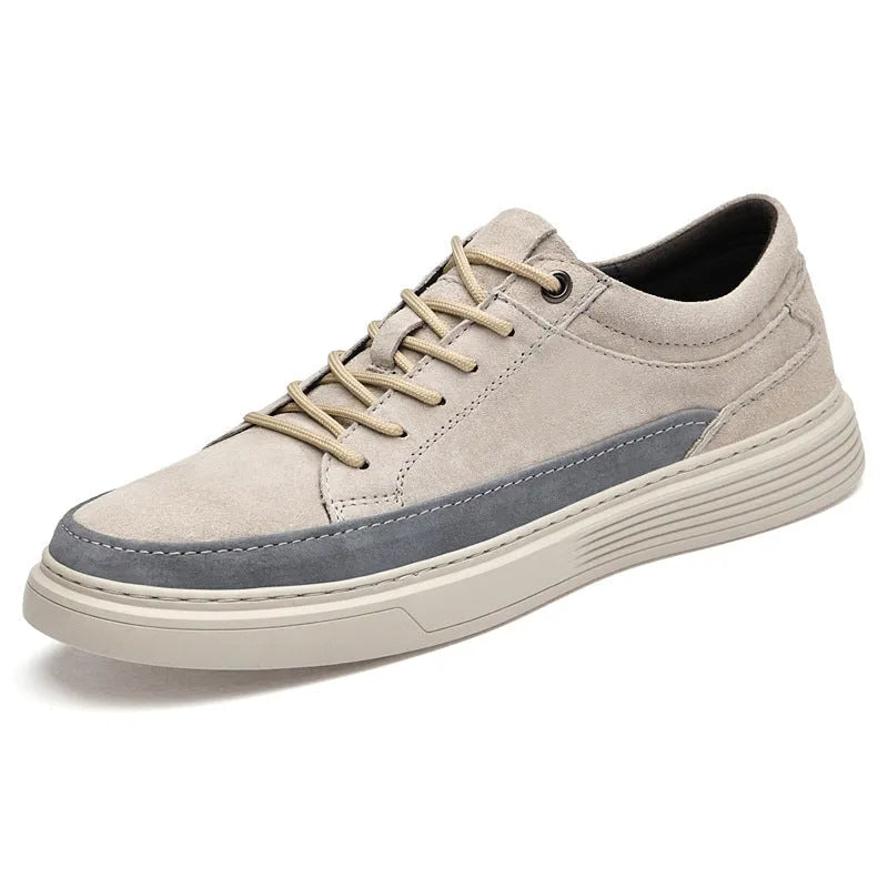 Men's grey low-top casual leather skate shoes with a round toe and flat rubber sole.