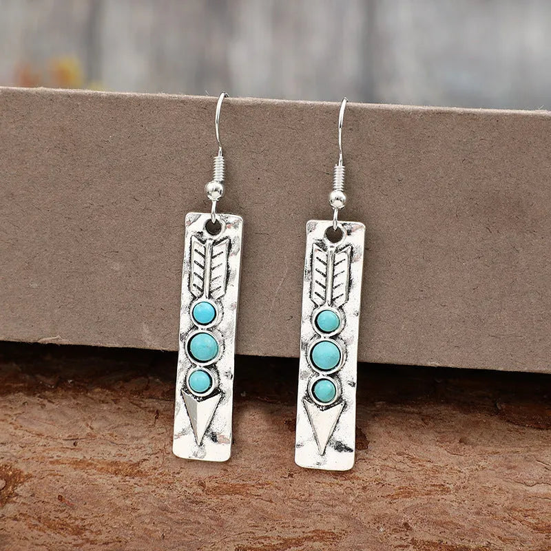 Silver geometric earrings with turquoise inlay on long strip zinc alloy retro design