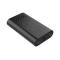 Black indoor smart security camera with WIFI and baby monitor functions on a table.