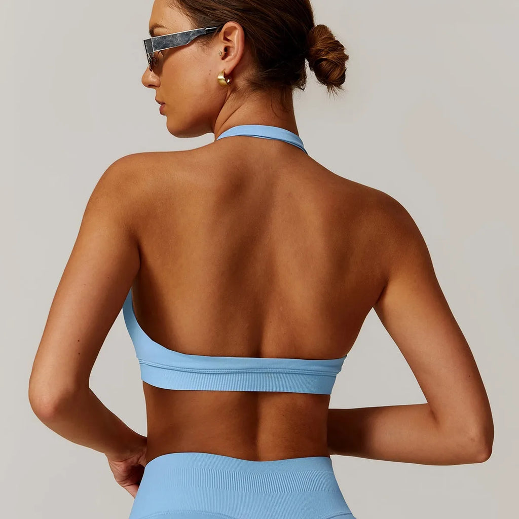Women's halter neck sports bra in plum purple colour on a mannequin