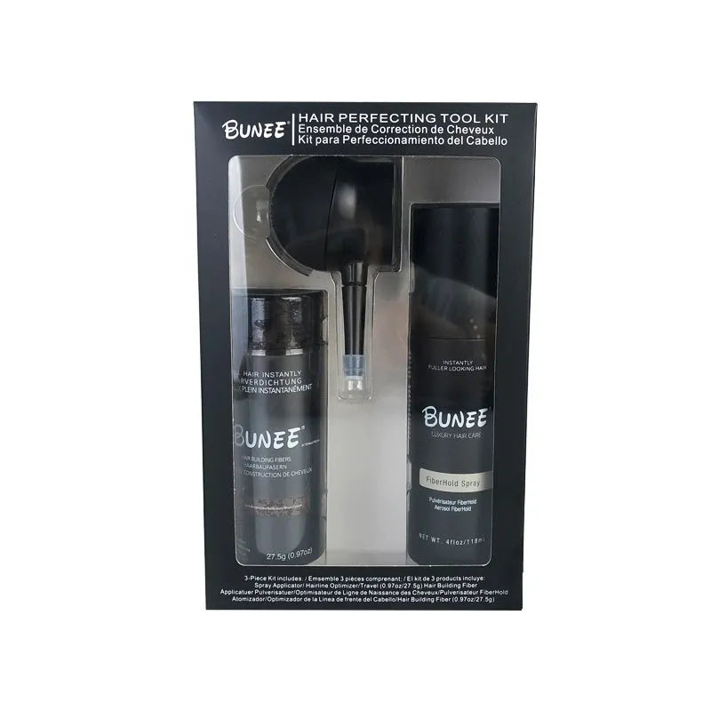 Hair fibre powder kit containing a 275g can, styling spray bottle, and applicator nozzle on a white background.