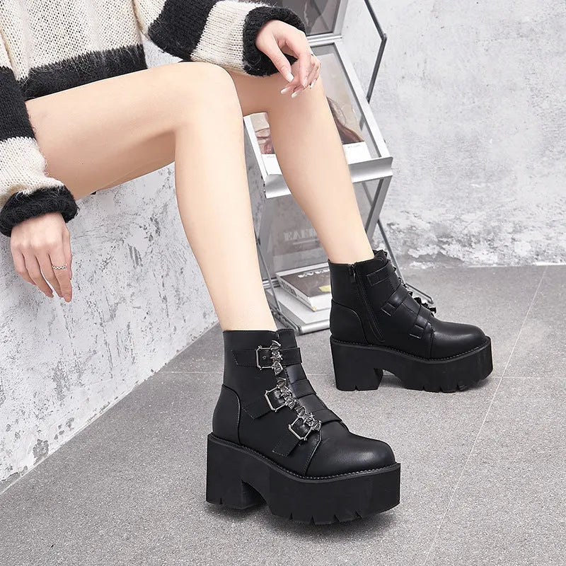 Black women's punk ankle boots with bat buckle and side zip closure