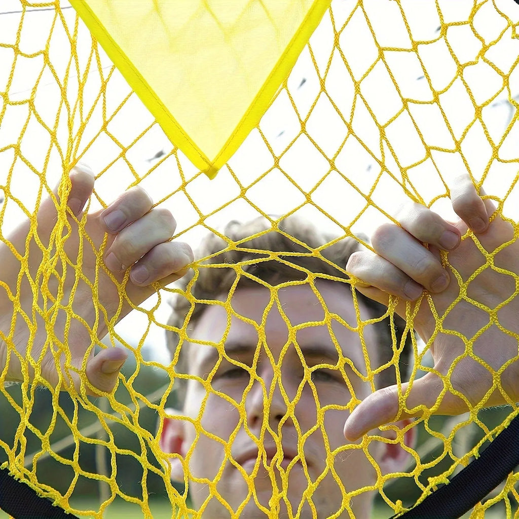 Portable soccer training goal net in black, used for practice shooting drills on grass