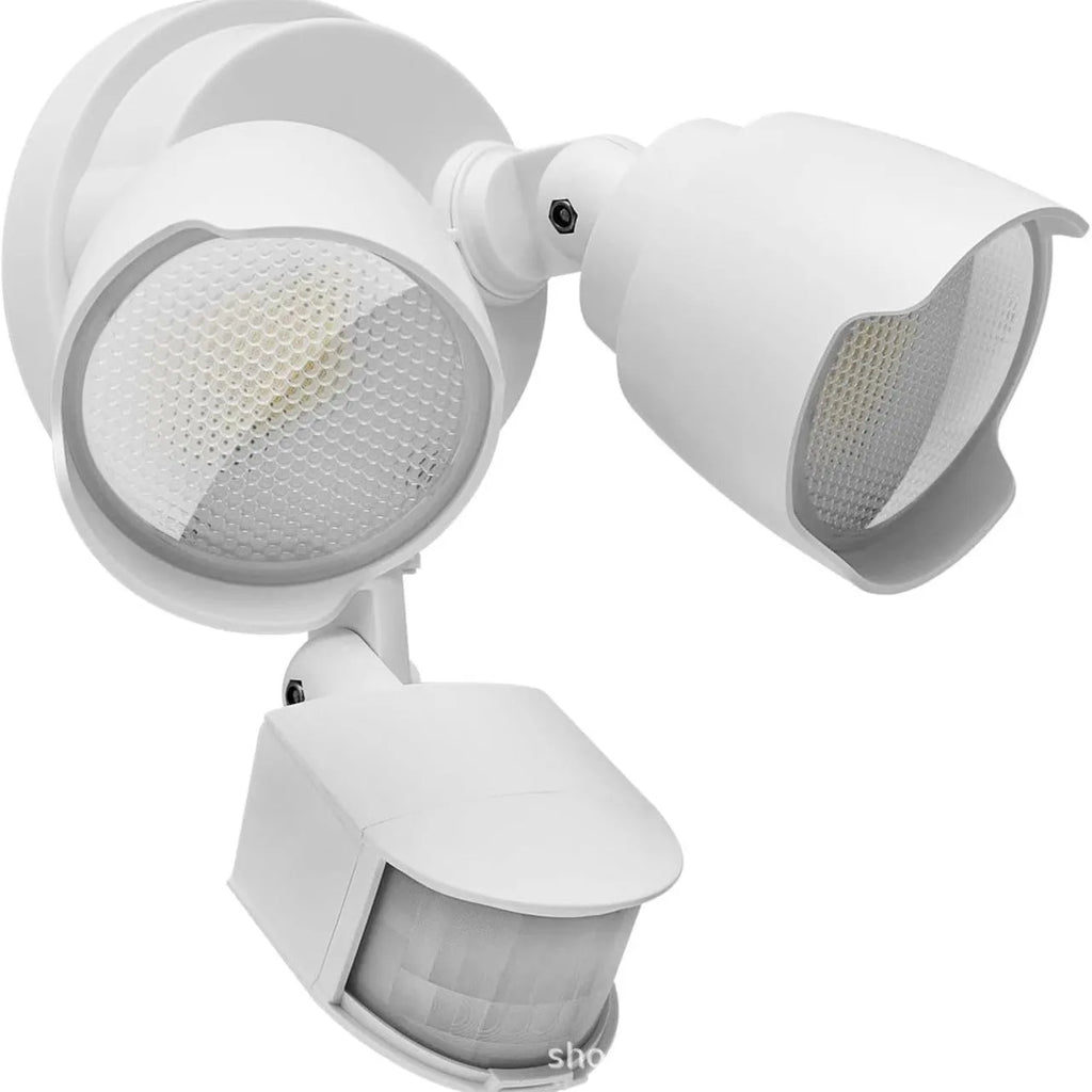 White 120V LED outdoor flood light with motion sensor for courtyard and garage security lighting