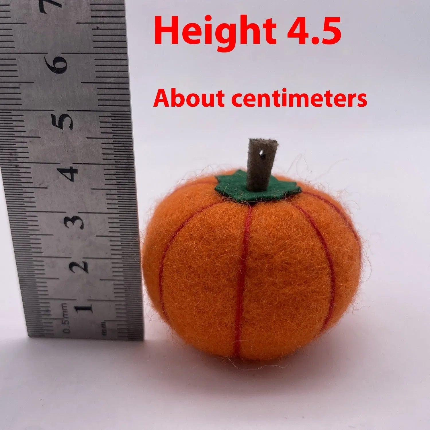 Wool felt pumpkin poke ornament in orange, approximately 5cm diameter and 4.5cm height, for doll decoration