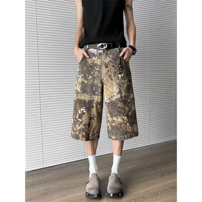 Yellow snake pattern camouflage cropped jeans showing detailed tooling print and denim construction