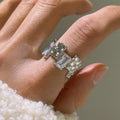 Silver geometric cross ring with open zircon stone setting and retro design