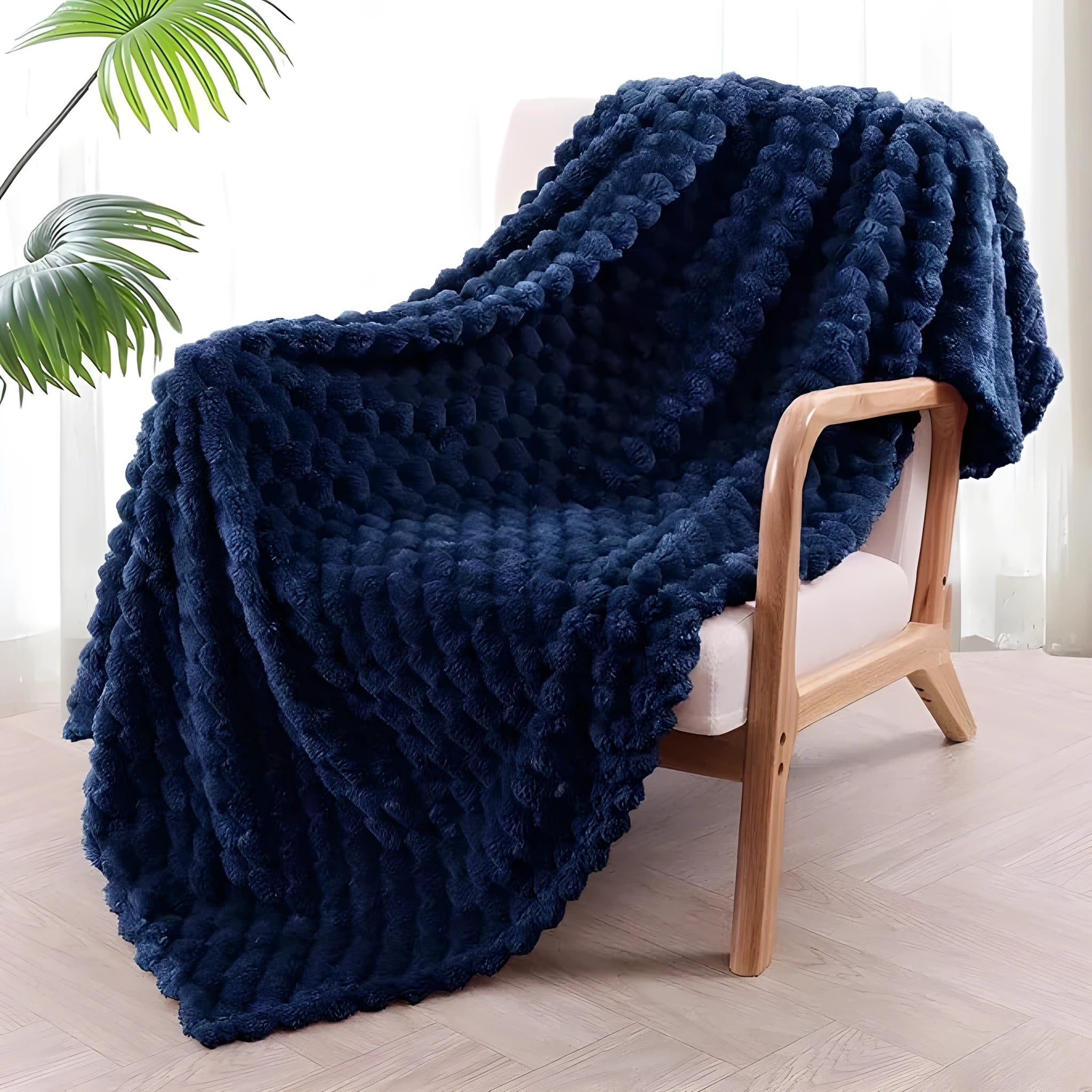 Children's soft polyester plaid blanket in camel colour, folded on a bed