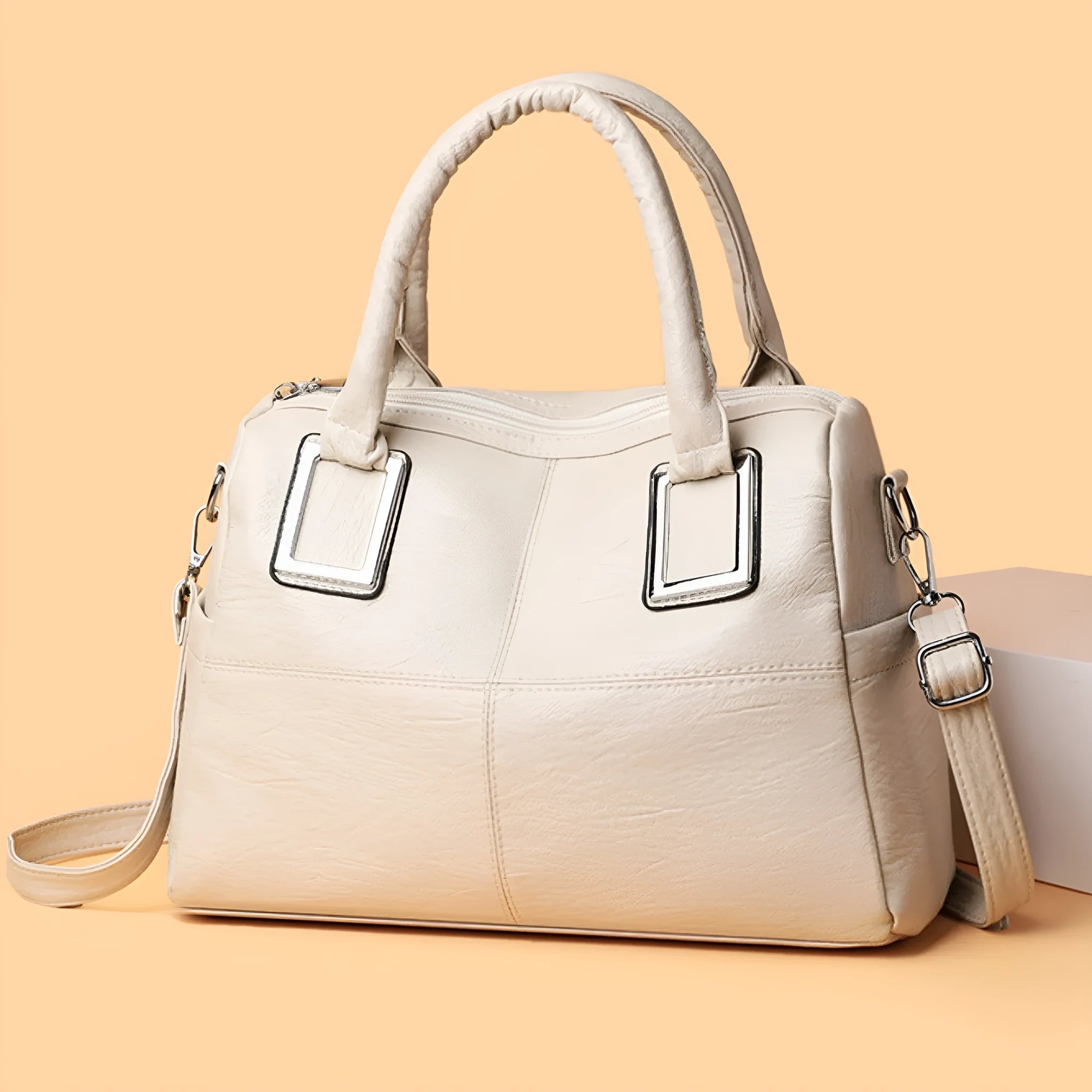 Simple large capacity women's shoulder bag in a horizontal square shape with internal phone and document pockets.