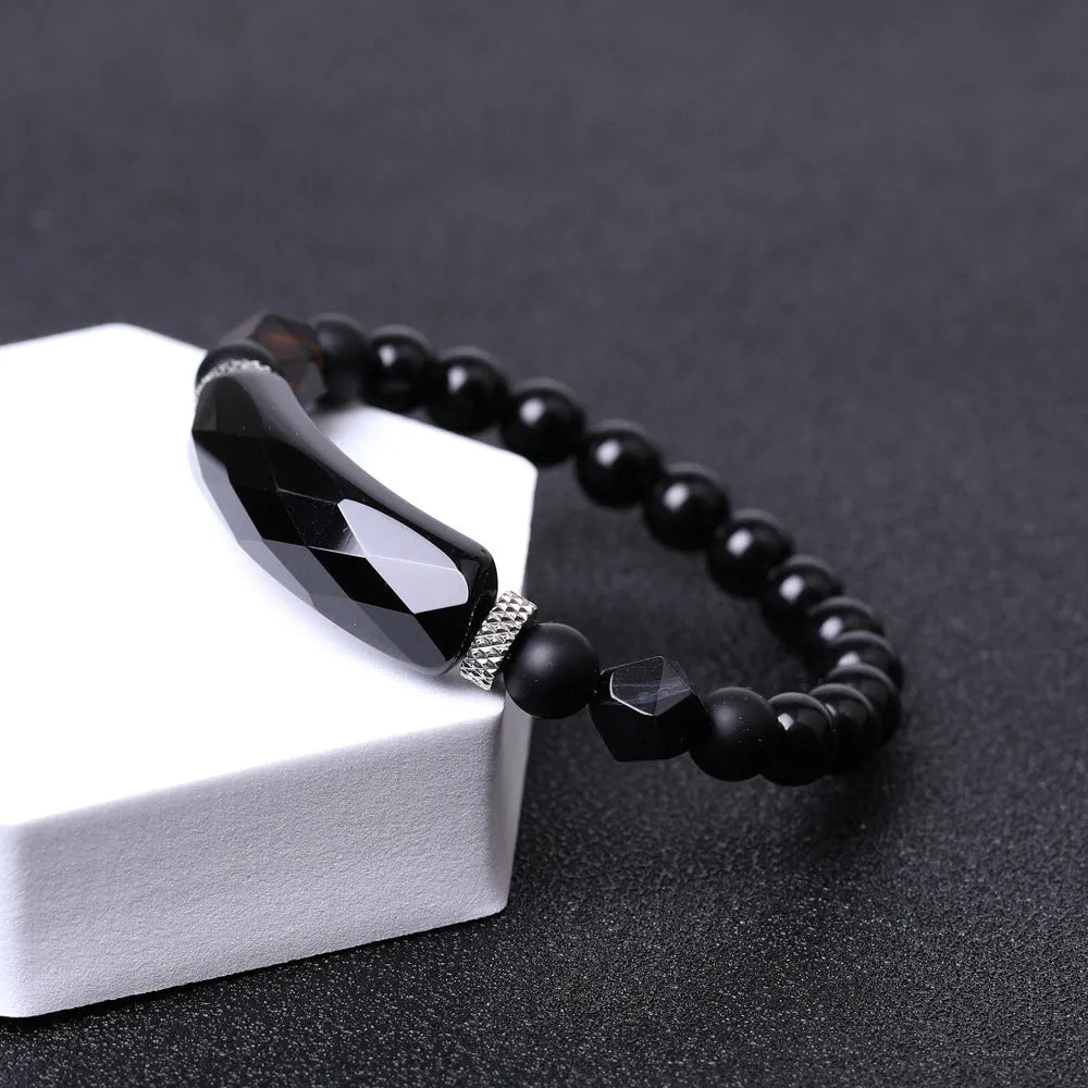 Handmade diamond-cut black agate bracelet for women and men on white background