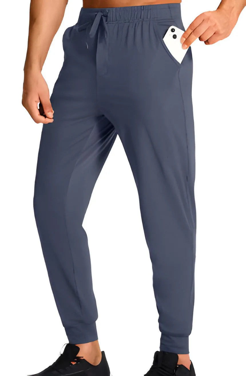 Men's loose fit casual trousers in solid colour made from polyester fabric