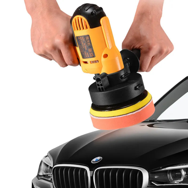 Yellow automotive polishing machine with 125mm disc on a workbench.