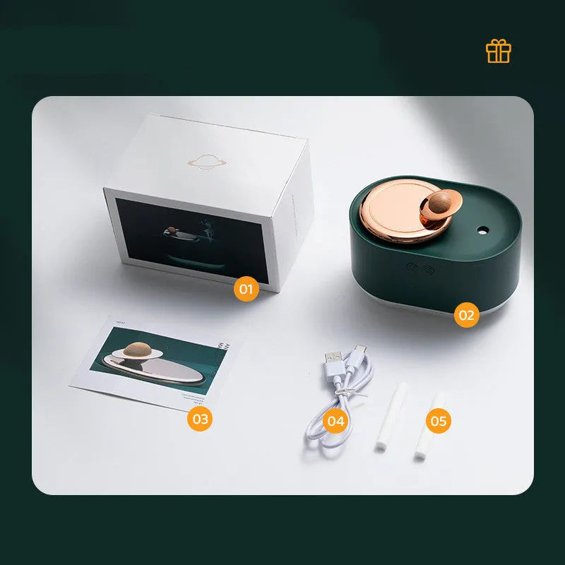 Green rotating planet-shaped USB humidifier with night light on wooden surface