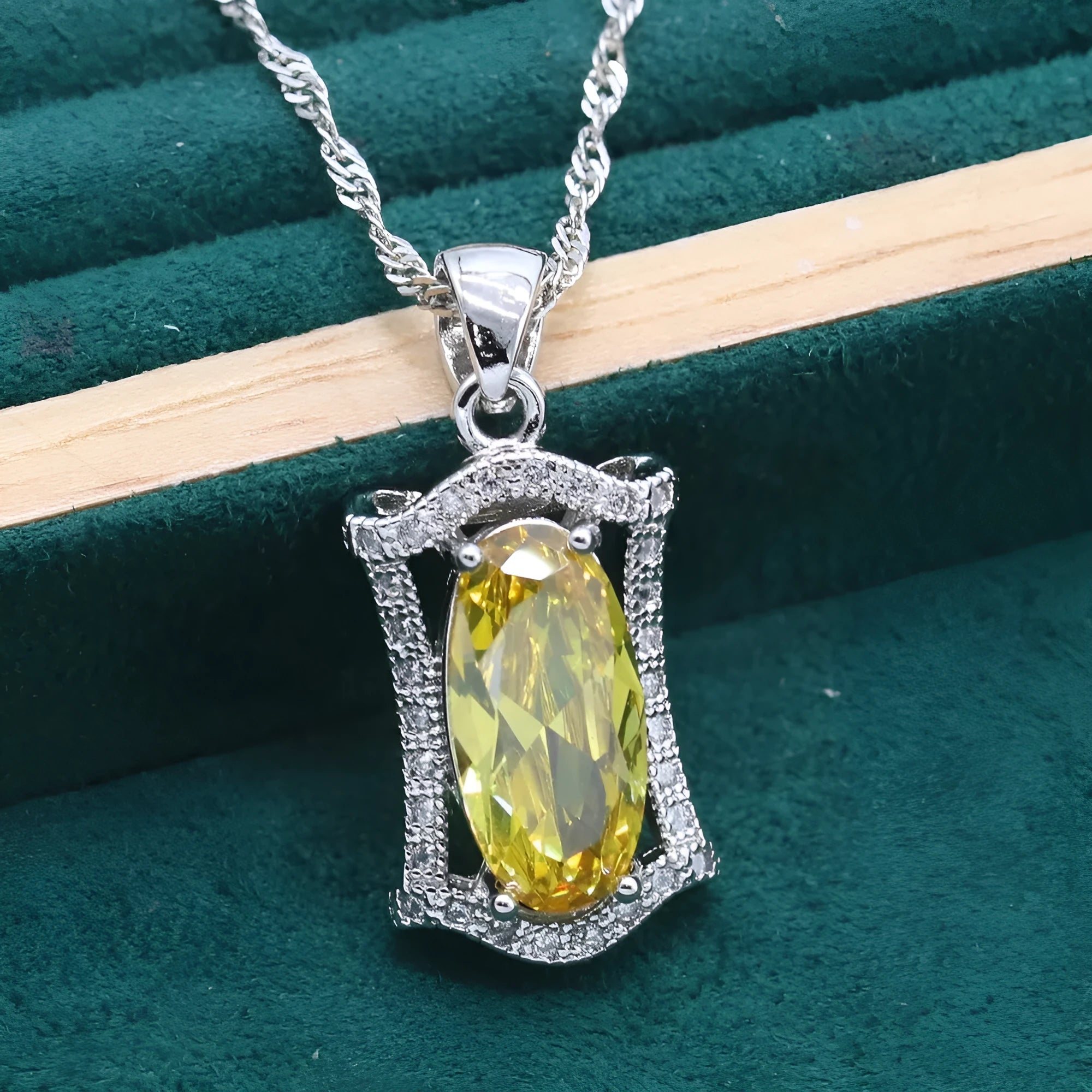 Yellow anti-allergy zircon jewellery set showing necklace, earrings, ring, and bracelet on a snake bone chain.