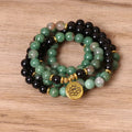 Green and black alloy bead elastic long bracelet on wrist.