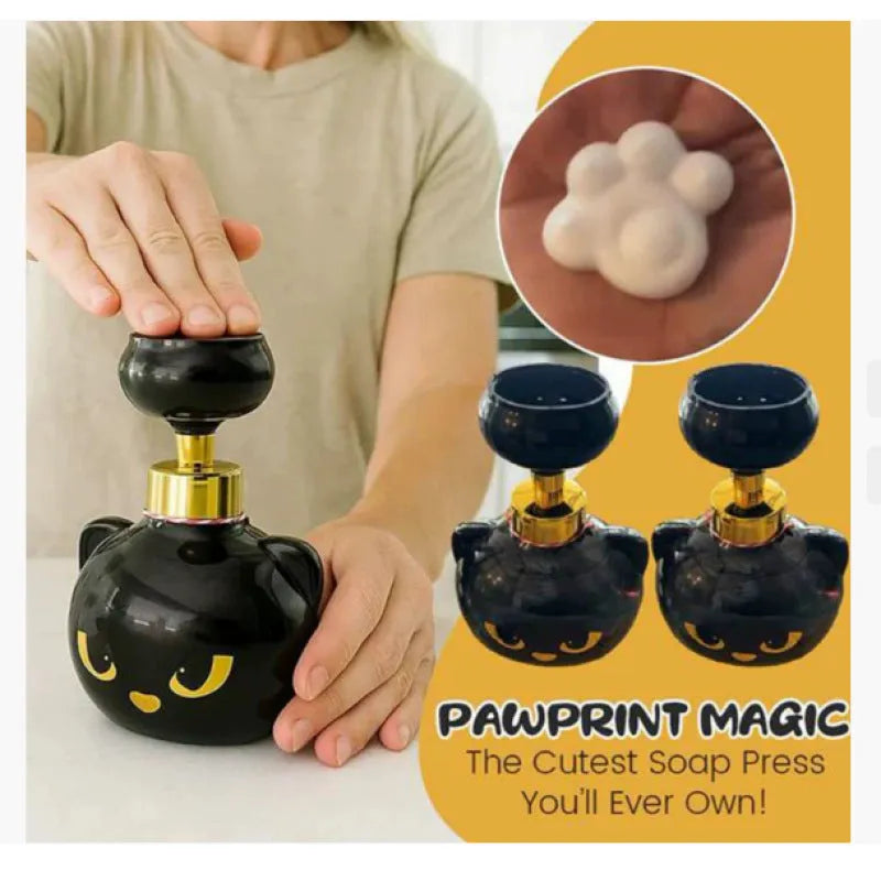 Black plastic cartoon cat-shaped foam soap dispenser on a countertop.