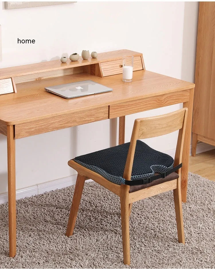 Memory foam seat cushion with an adjustable strap in black, grey, and creamy white colours.