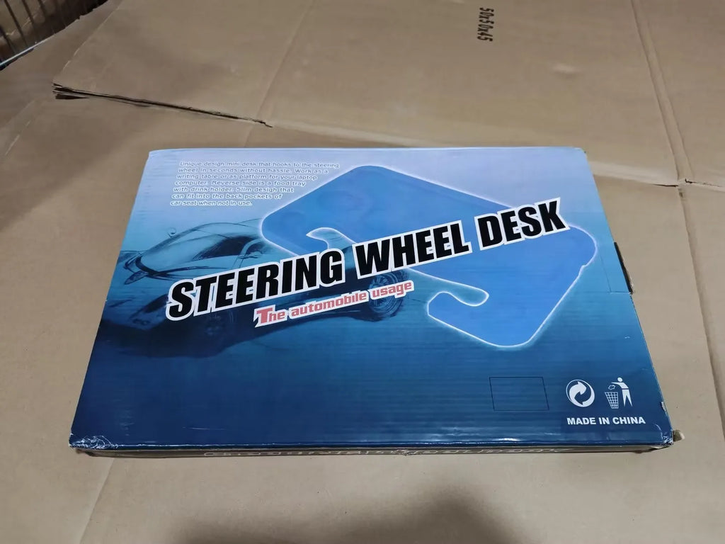 Black HDPE car steering wheel tray large size resting on a steering wheel with a laptop and cup of coffee